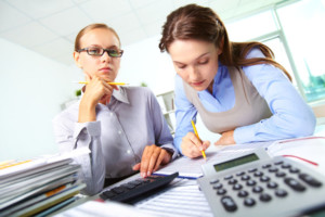 Accountants working on business financial numbers